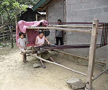 A Tribal Woman working with a Loom by Asienreisender